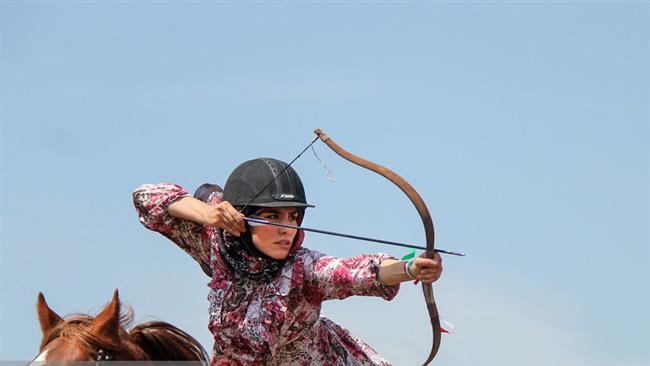 Female Iranian archer taking part in the 24th nomadic culture and sports festival held in the East Azerbaijan province on May 6, 2017.jpg